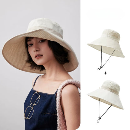 Ivory reversible wide brim cotton linen sun hat with chin strap shown on model