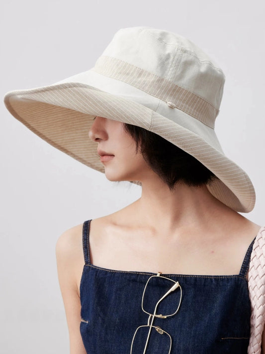 Ivory foldable cotton linen sun hat with wide brim styled for casual summer wear