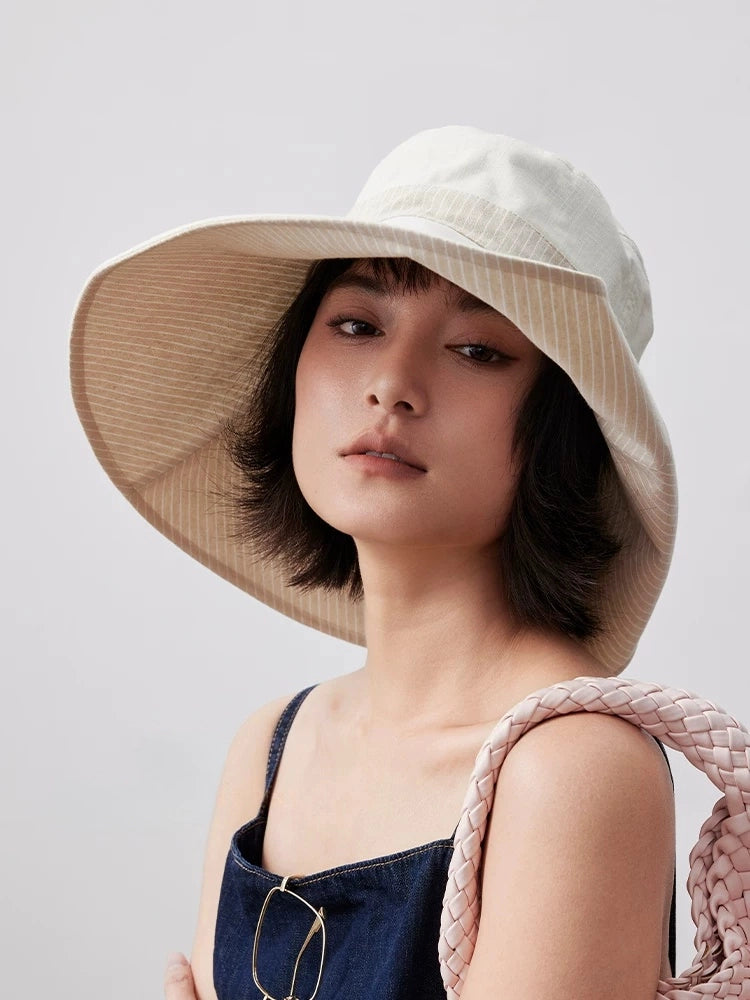 Front view of ivory reversible wide brim sun hat with lightweight cotton linen fabric