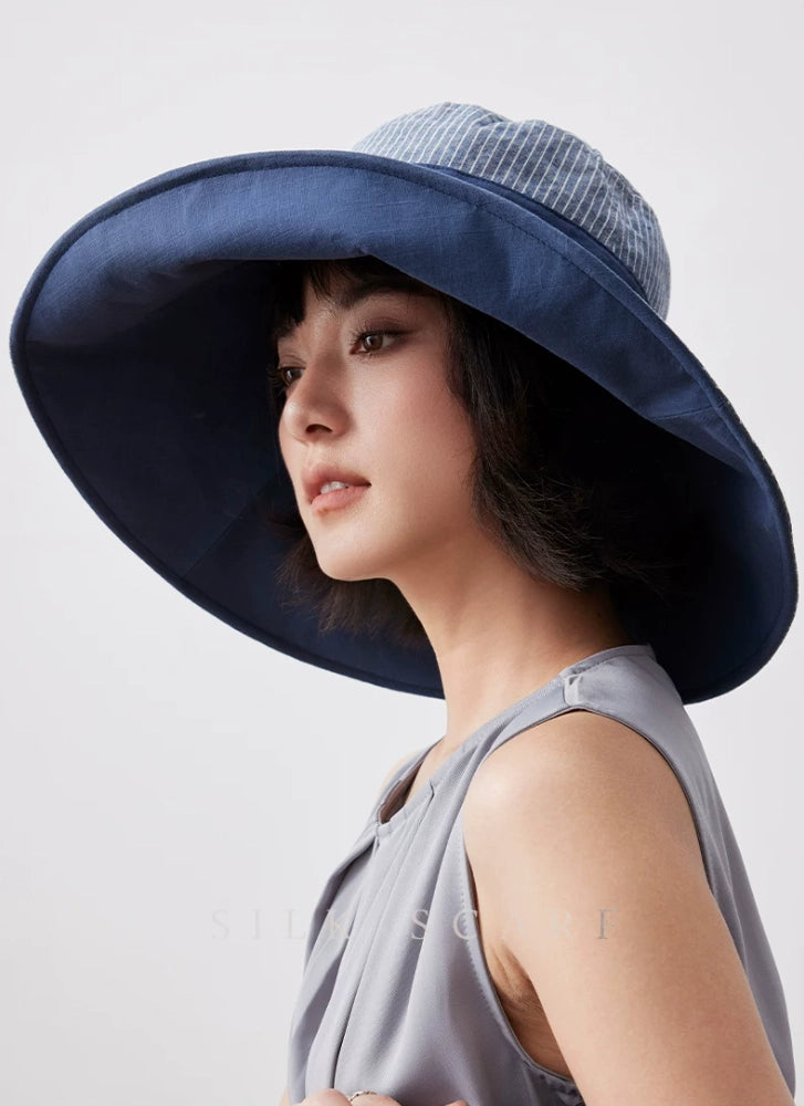 Side view of smoky blue cotton linen sun hat with full coverage wide brim