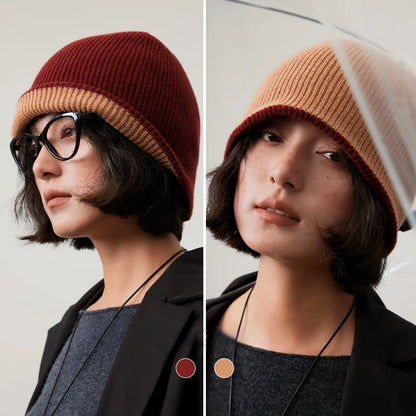 Rust brown and camel reversible wool beanie modeled with each side facing outward.