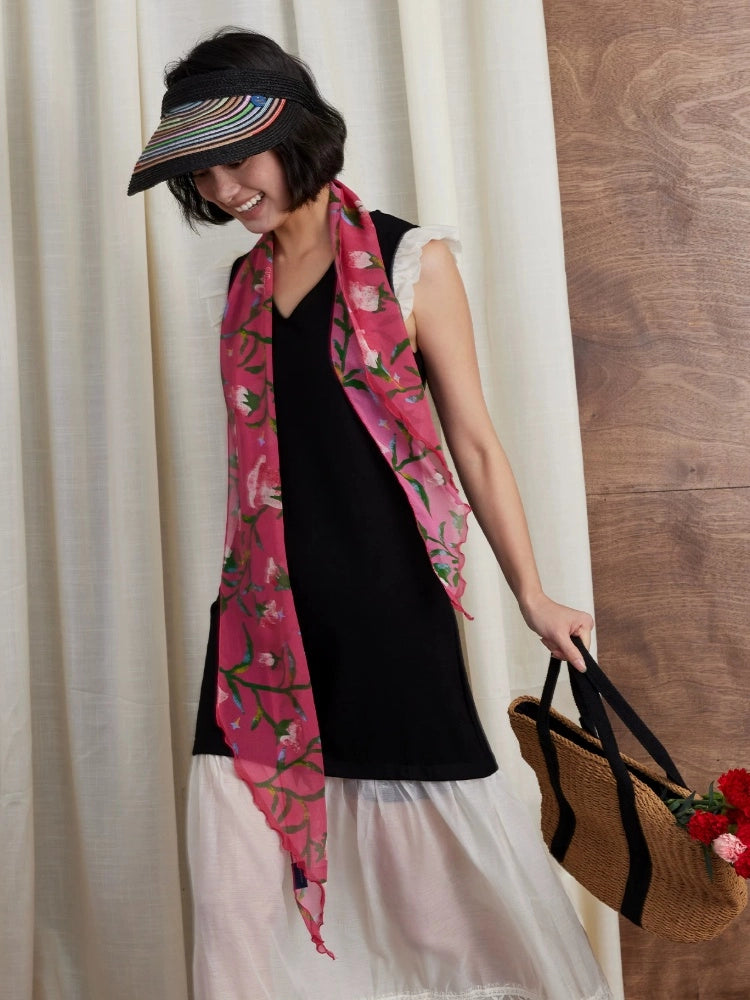 Rose red morning glory skinny silk scarf styled as a hair accessory and neck scarf