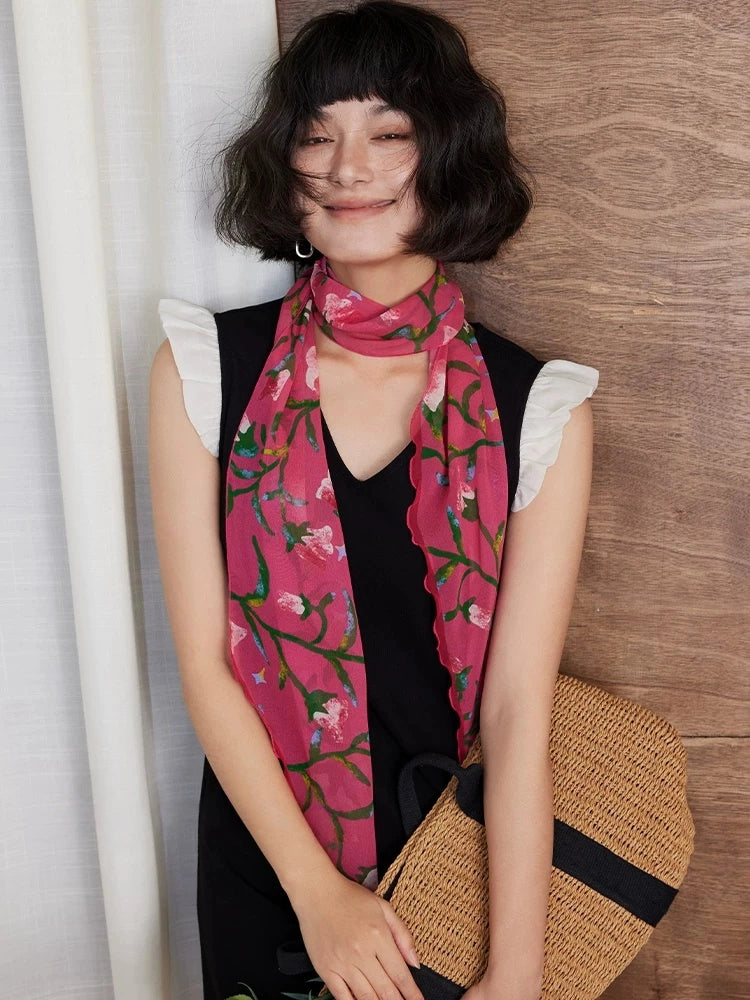 Rose red morning glory long silk scarf draped from the neck with black dress styling