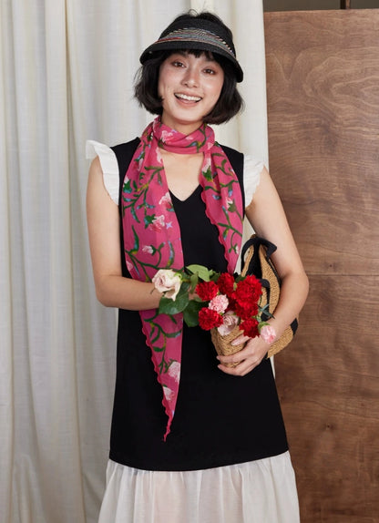 Rose red morning glory silk scarf worn with sleeveless black dress for elegant styling