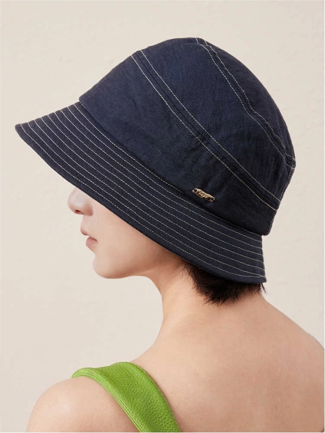 Off white short brim bucket hat back view on model, lightweight cotton linen bucket hat for women
