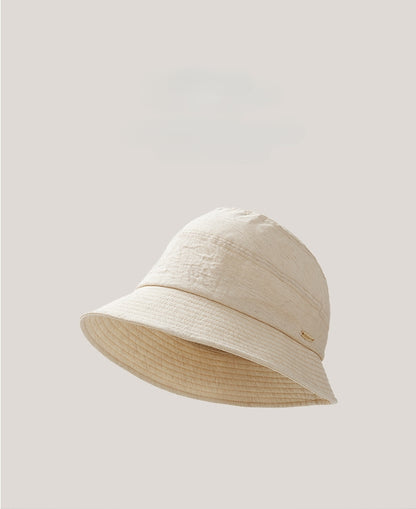 Off white short brim bucket hat product display, soft cotton linen foldable sun hat