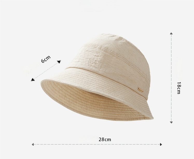 Denim blue short brim bucket hat portrait side view, stylish lightweight bucket hat for women