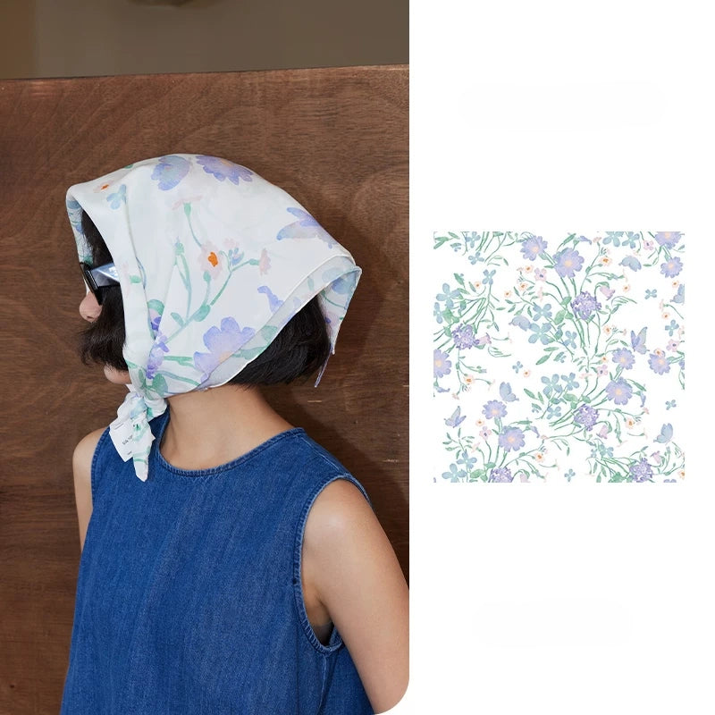 Elegant watercolor floral silk square scarf styled as a headscarf with soft pastel flower print