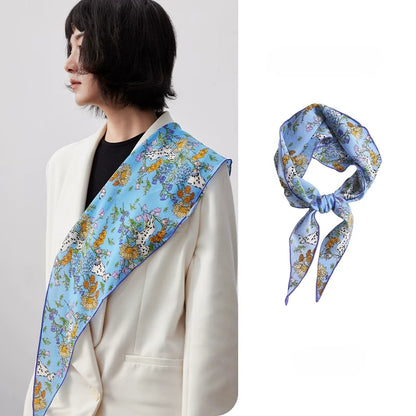 Blue floral silk scarf draped on shoulder, mulberry silk scarf outfit styling