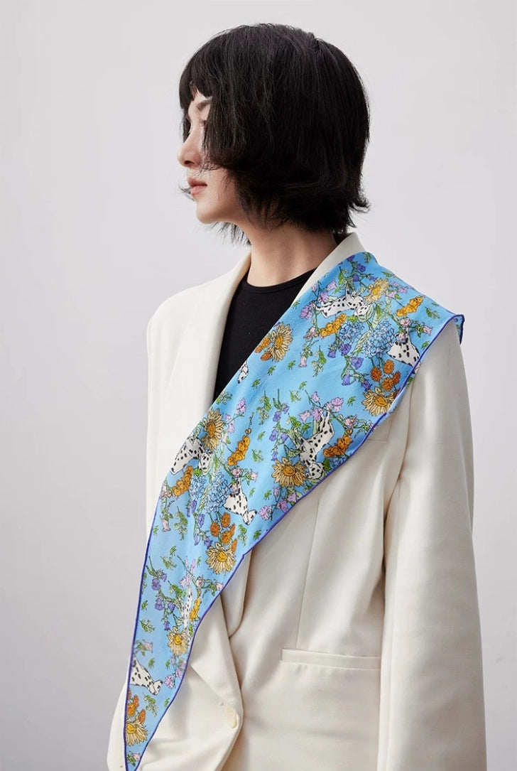 Blue floral silk scarf draped across shoulder, lightweight silk scarf styling