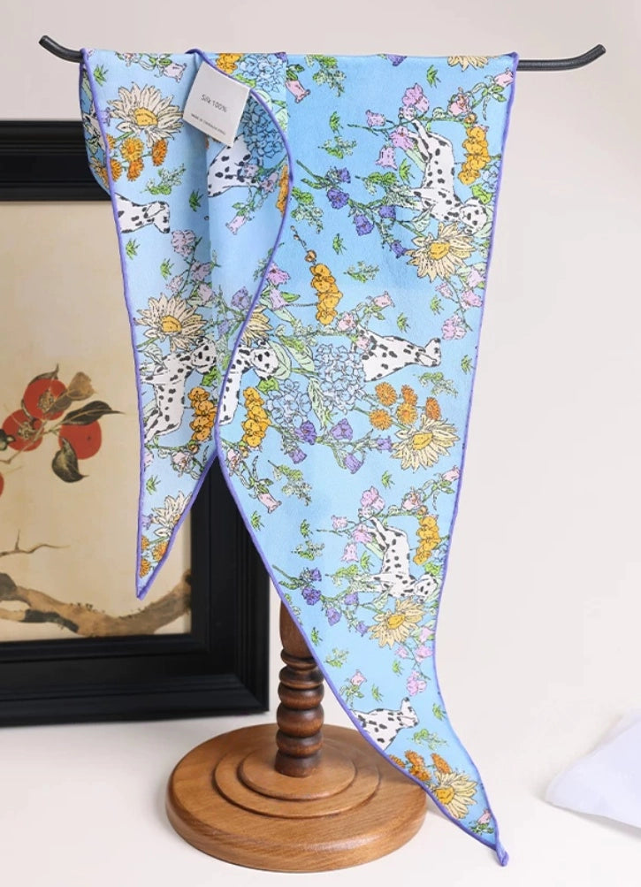 Blue floral silk scarf displayed unfolded, mulberry silk detail view