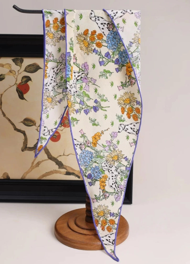 Floral mulberry silk scarf displayed on stand, lightweight silk scarf