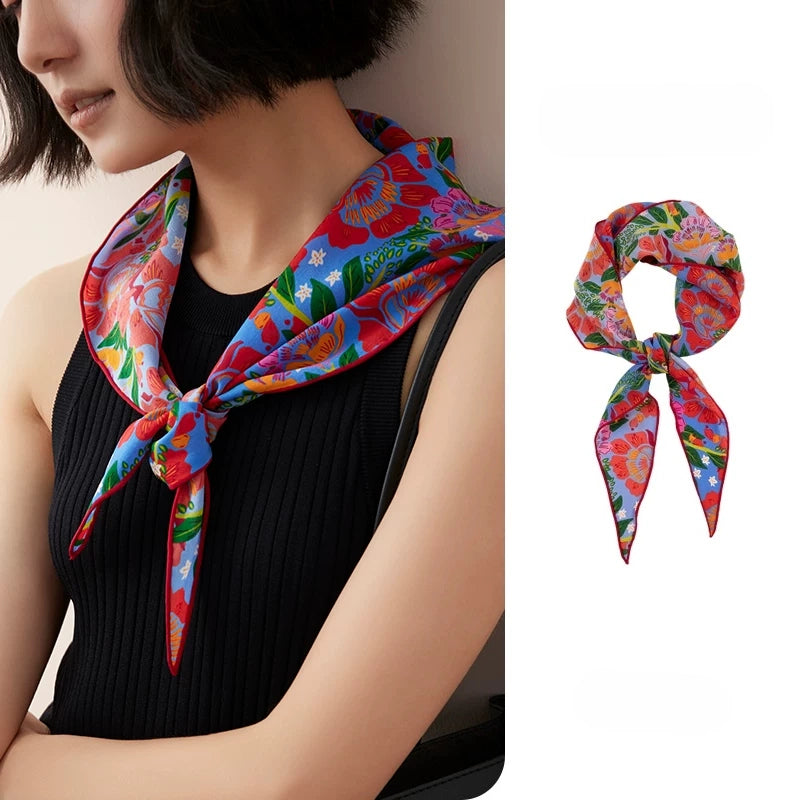 Floral silk triangle scarf worn as elegant neck scarf on model