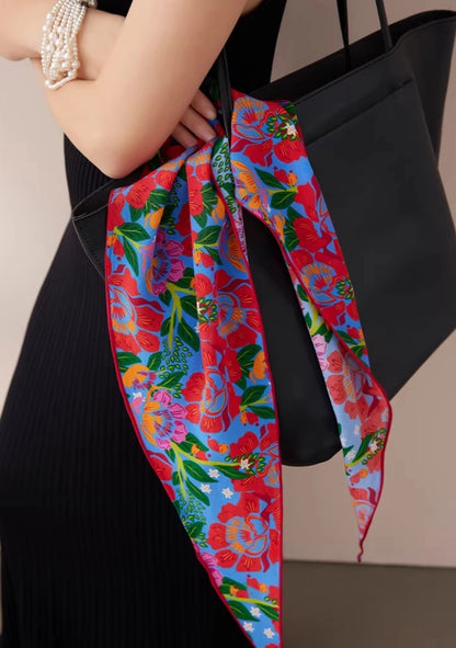silk triangle scarf tied on handbag colorful floral accessory detail