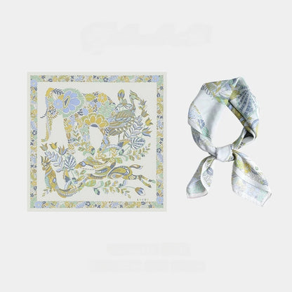 Snow Mountain Blue 65 cm mulberry silk scarf with vintage elephant and floral artwork, shown flat and tied