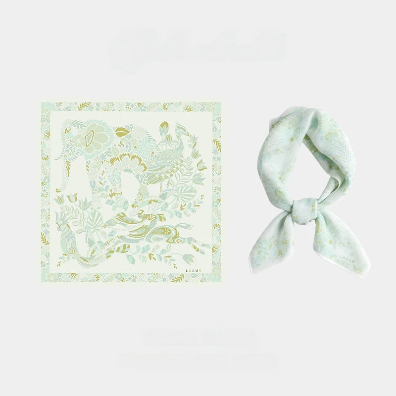 Tender green 65 cm mulberry silk square scarf with vintage elephant and floral print, shown flat and tied