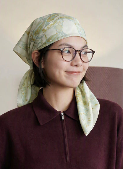Tender green botanical elephant silk scarf styled as a vintage hair scarf