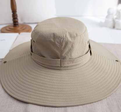Khaki waterproof hiking sun hat with foldable wide brim and adjustable strap detail