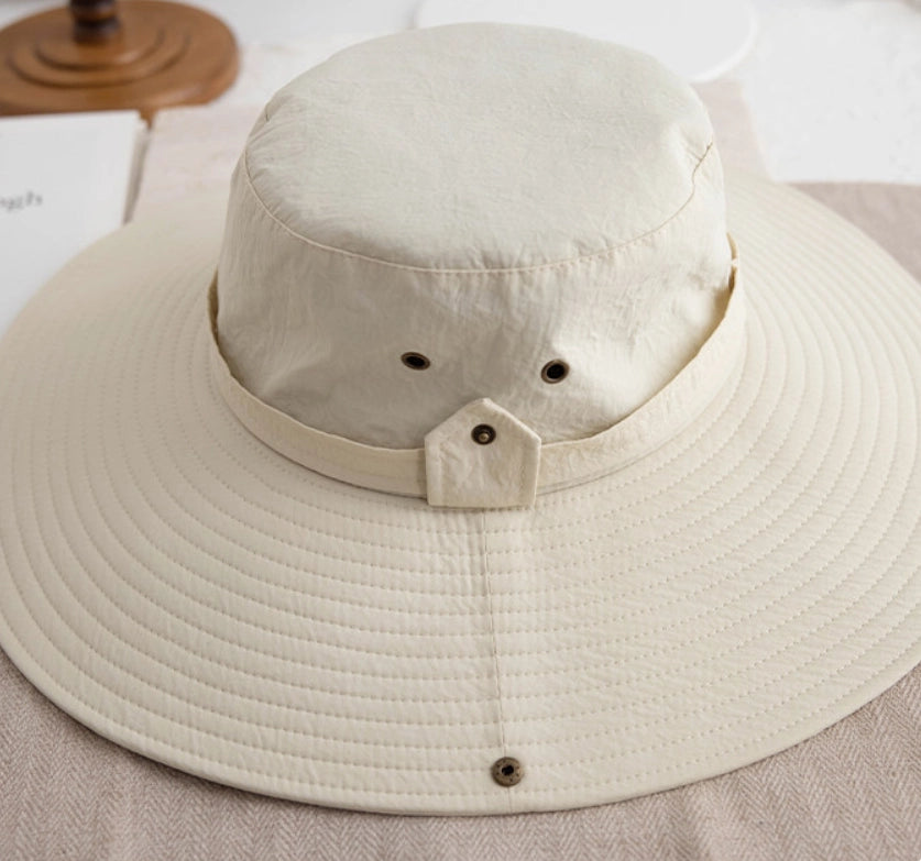 Off white waterproof sun hat showing wide brim, crown detail, and adjustable back