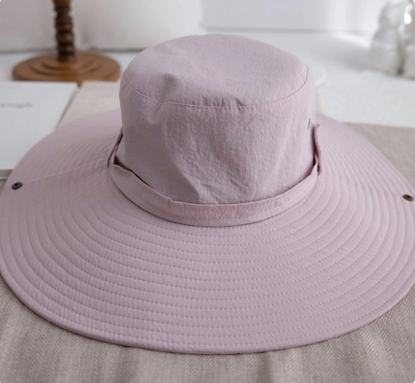 Pink waterproof hiking sun hat showing foldable brim, crown detail, and strap design