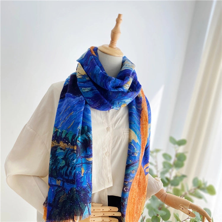 Van Gogh Starry Night wool scarf loosely draped on a mannequin with long blue and orange fringed ends