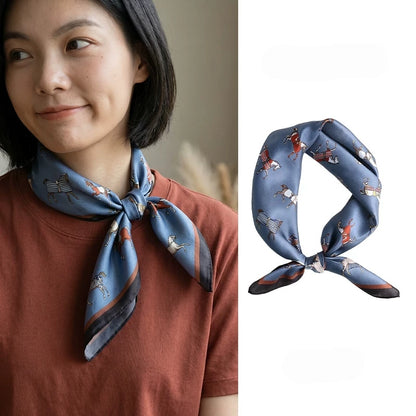 Vintage blue horse print mulberry silk scarf styled around the neck with a side knot