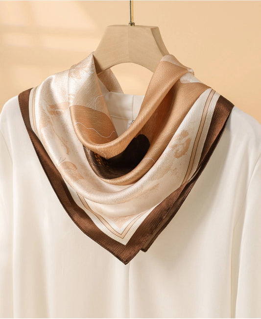 Vintage brown floral silk square scarf styled around the neck over an ivory blouse