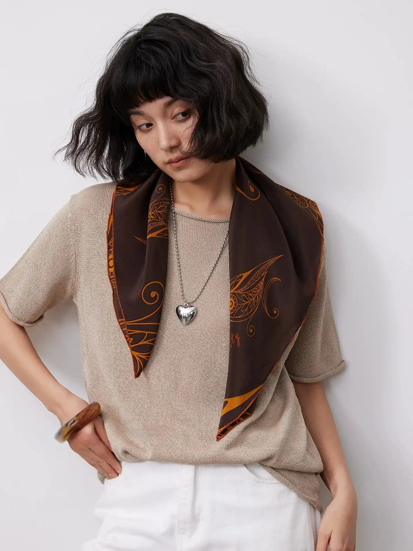 Brown mulberry silk scarf styled with a neutral outfit for an elegant everyday vintage-inspired look.