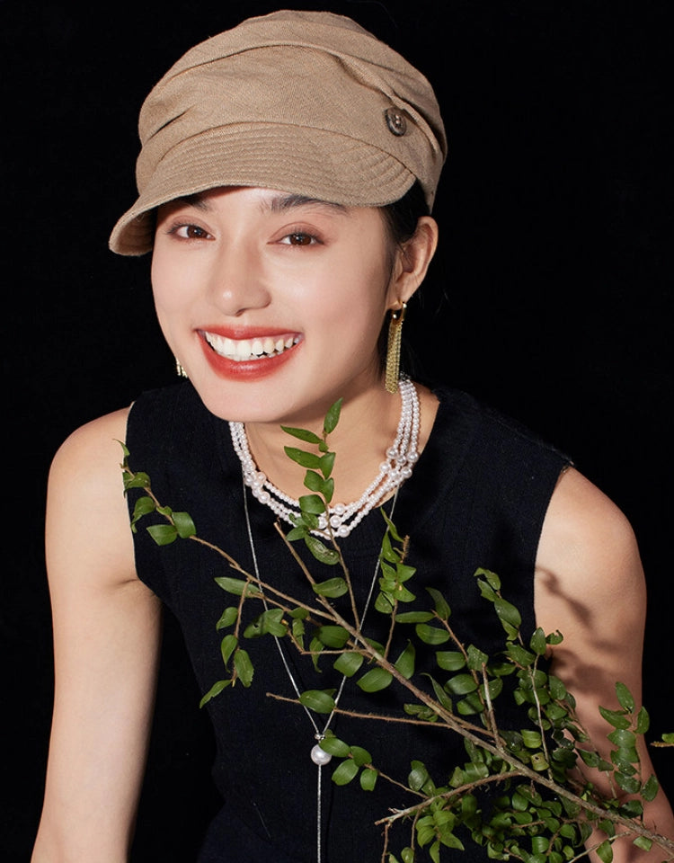 Model wearing light khaki vintage beret newsboy cap for casual retro styling