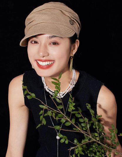 Model wearing light khaki vintage beret newsboy cap for casual retro styling