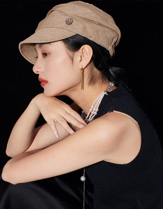 Side profile of light khaki cotton linen beret hat for women with short brim