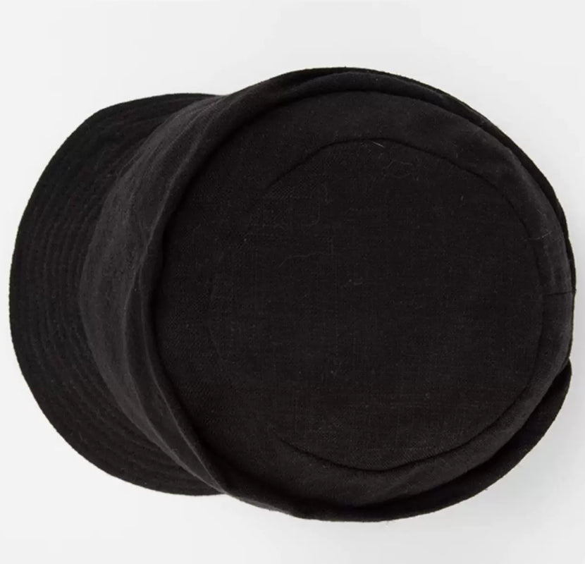 Top view of classic black cotton linen beret hat with soft structured crown