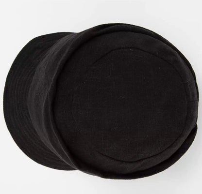 Top view of classic black cotton linen beret hat with soft structured crown
