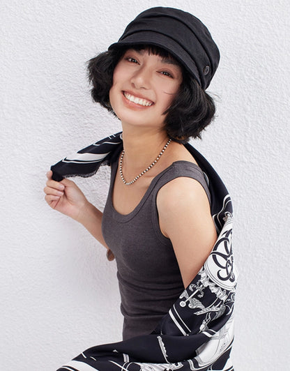 Model wearing classic black vintage beret newsboy cap for chic everyday outfit