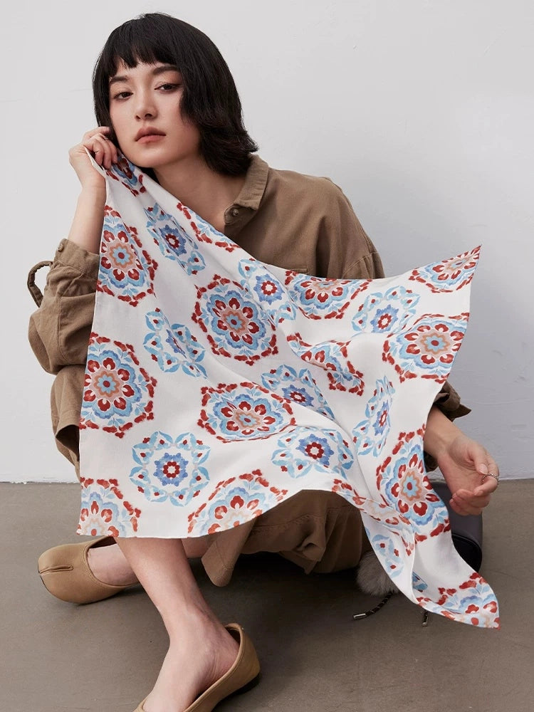 Blue vintage floral geometric silk square scarf made from 100% mulberry silk, shown as an elegant fashion accessory.