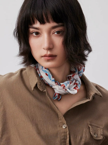 Vintage floral silk square scarf tied around the neck as an elegant silk bandana for women.