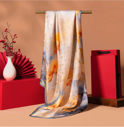 Ivory gold printed silk scarf with vintage floral artwork, long oblong shape, and soft elegant sheen.