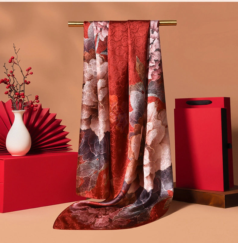 Burgundy floral 100% mulberry silk scarf with vintage pattern, smooth feel, and refined long silhouette.
