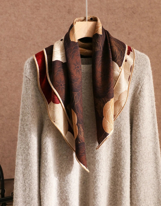 Brown burgundy silk wool square scarf styled around the neck with a soft sweater.