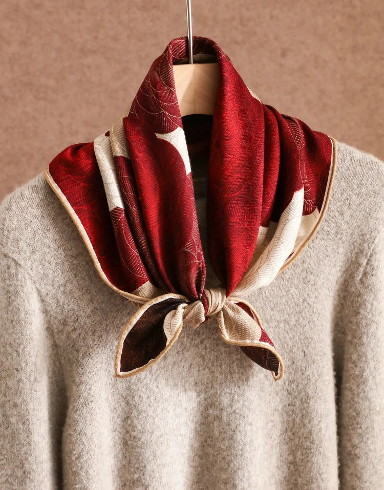 Double-sided silk wool floral scarf in burgundy and cream styled as a chic neck scarf.