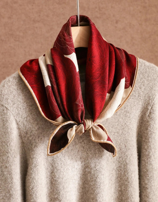 Double-sided silk wool floral scarf in burgundy and cream styled as a chic neck scarf.