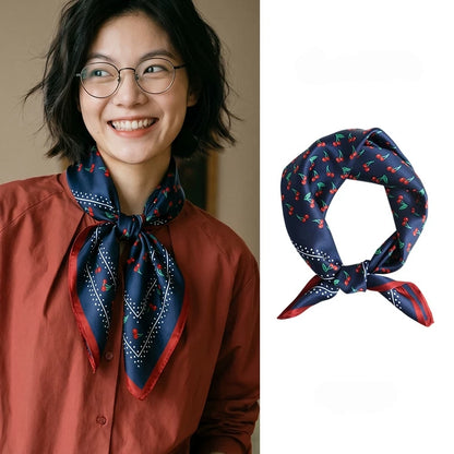 Vintage navy cherry mulberry silk square scarf styled around the neck and displayed in a knotted shape