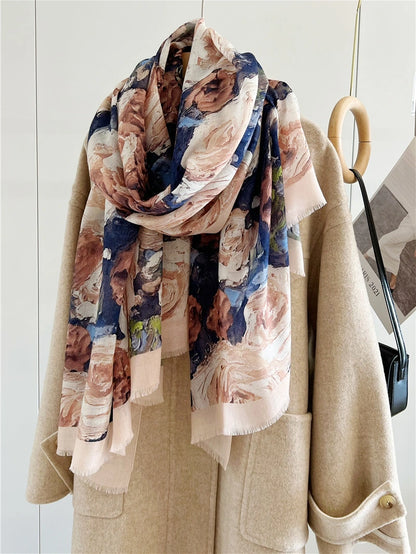 Vintage rose wool scarf loosely looped over a beige coat with long floral ends draping in front