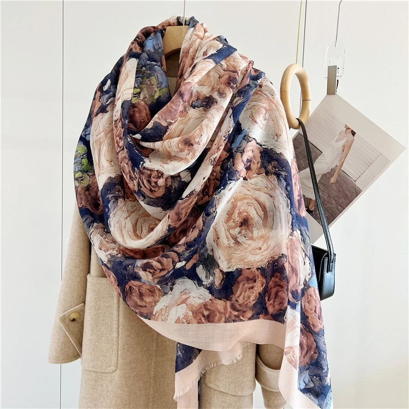 Vintage rose printed wool shawl styled in a voluminous asymmetric wrap over a neutral coat