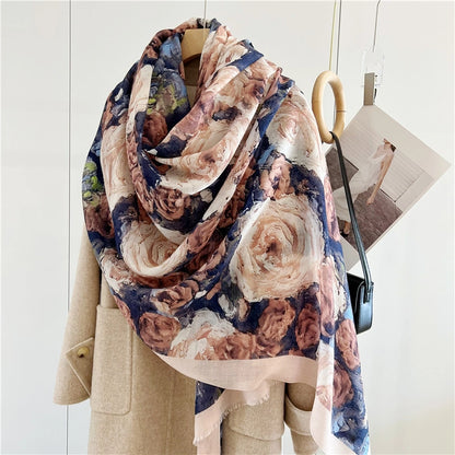 Vintage rose printed wool shawl styled in a voluminous asymmetric wrap over a neutral coat