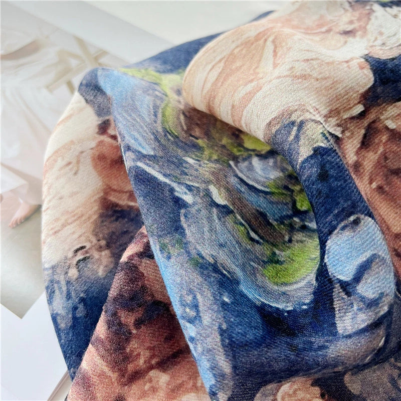Detail of blue and ivory rose print on the soft semi-sheer vintage floral wool scarf