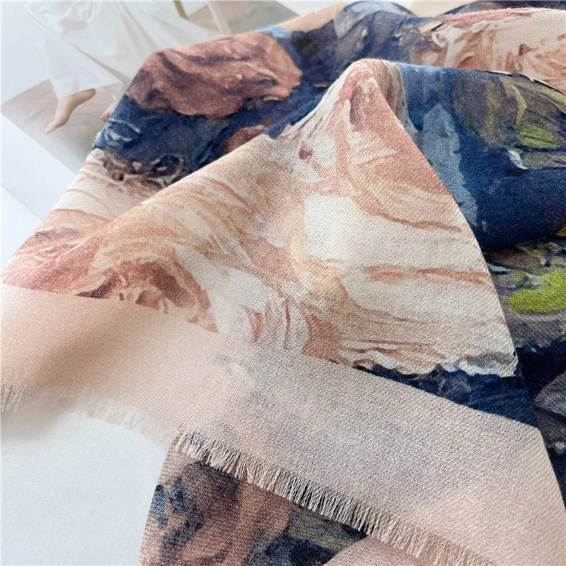 Close-up of blush pink border and delicate fringed edge on a vintage rose printed wool scarf