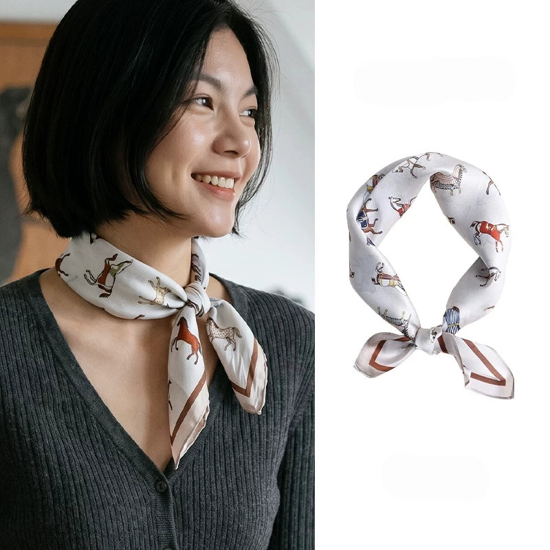 Vintage white horse print mulberry silk scarf styled around the neck with a side knot