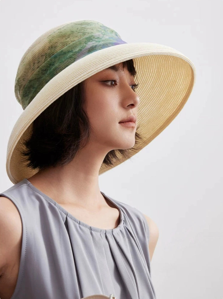 Side view of vintage white wide brim sun hat with dome crown and scarf ribbon.