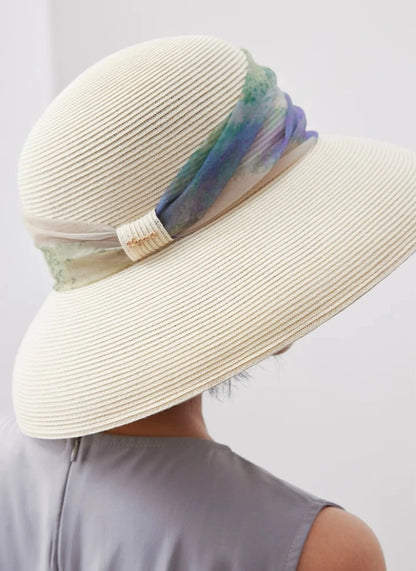 Rear view of vintage white scarf ribbon sun hat with dome crown and wide brim.
